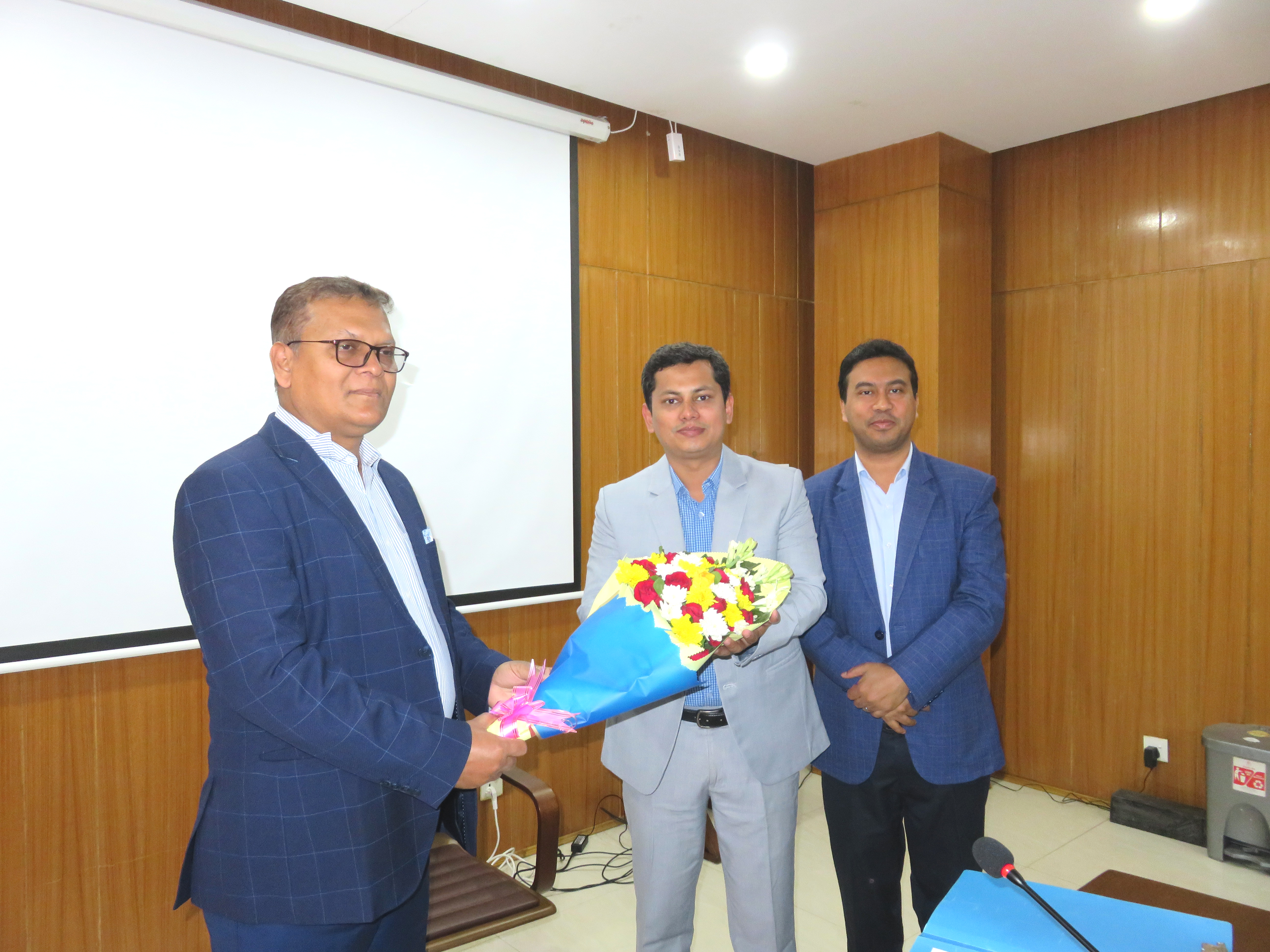 The Honorable Director General welcomed the newly appointed Deputy Director Mr. Md. Ariful Islam Khan with a bouquet of flowers.